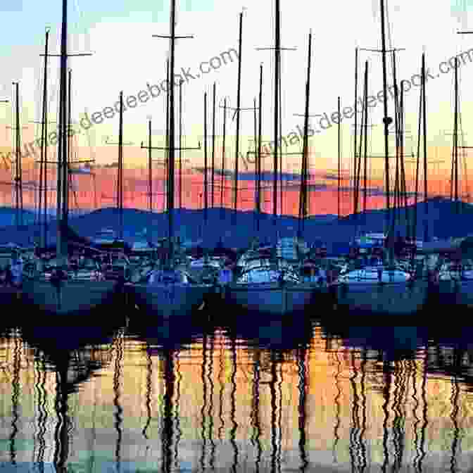 A Breathtaking Sunset Over The Mediterranean Sea In St. Tropez, With Sailboats And Yachts In The Foreground Sunset In St Tropez: A Novel