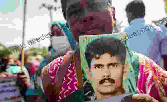 A Family Of Sri Lankan Tamils Holds A Photograph Of Their Missing Loved One During A Protest For Truth And Justice. Twelve Cries From Home: In Search Of Sri Lanka S Disappeared